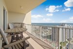 Spacious balcony features high quality furniture and beautiful Gulf views